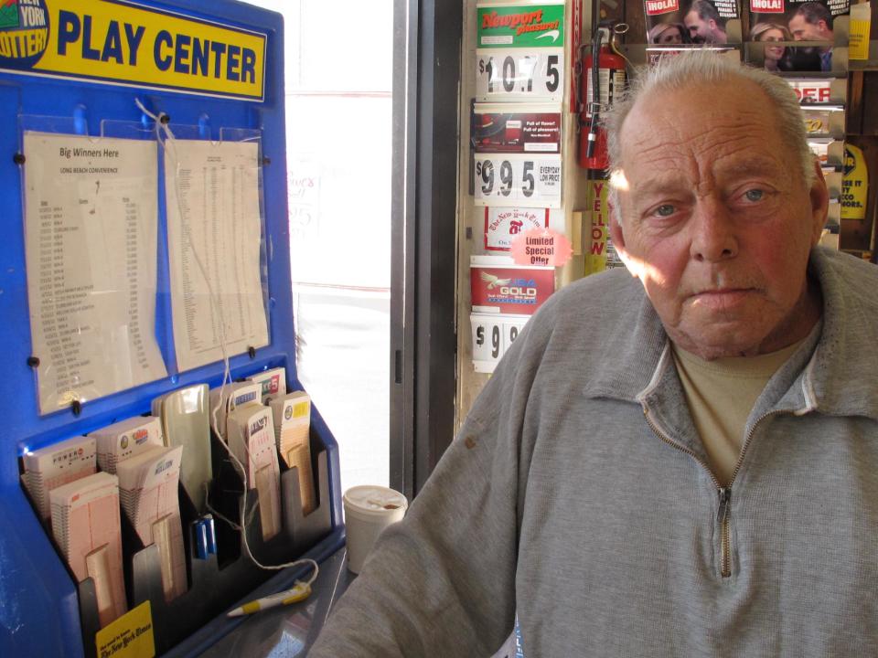 Raymond Parker mulls what he might do with the winning Powerball jackpot inside a stationery store  in Long Beach, N.Y. on Monday, Nov. 26, 2012. The 67-year-old Long Beach resident, who's car was destroyed in Superstorm Sandy, said he is rooting for multiple winners of the $425 million jackpot. (AP Photo/Frank Eltman)