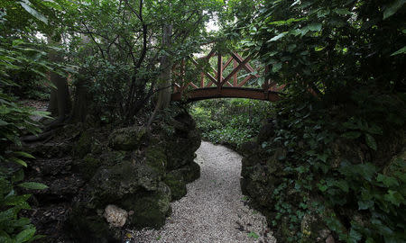 A wooden bridge is seen in the garden of the Hotel Dei Dogi, part of the hotel chain Boscolo in Venice, Italy, March 15, 2018. REUTERS/Stefano Rellandini