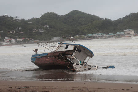 A damaged boat is pictured on the shore of San Juan del Sur Bay after tropical storm Nate in San Juan del Sur, Nicaragua October 6,2017.REUTERS/Oswaldo Rivas