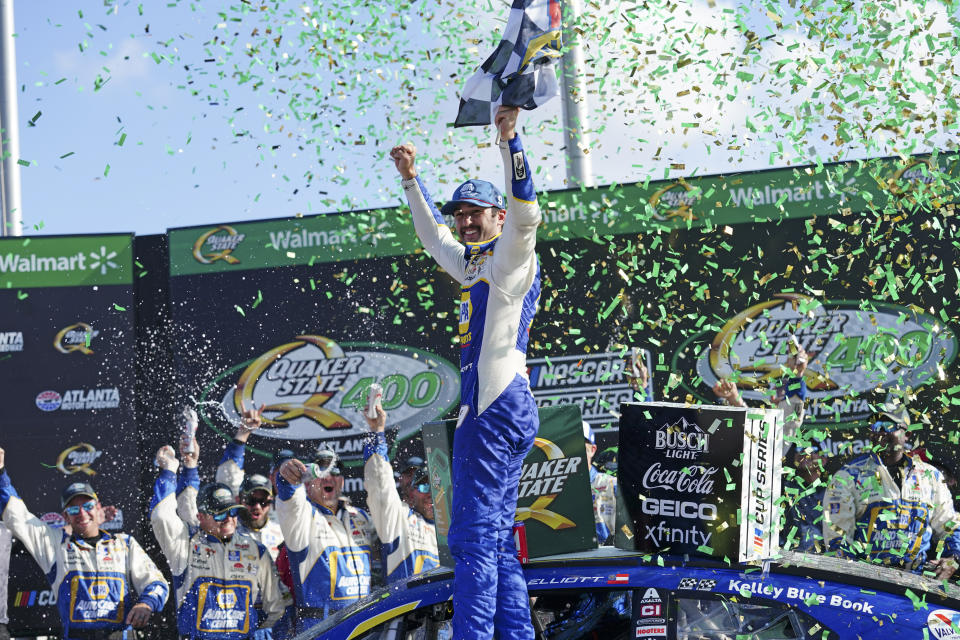 Chase Elliott (9) reacts in Victory Lane after winning the NASCAR Cup Series auto race at Atlanta Motor Speedway, Sunday, July 10, 2022, in Hampton, Ga. (AP Photo/John Bazemore)