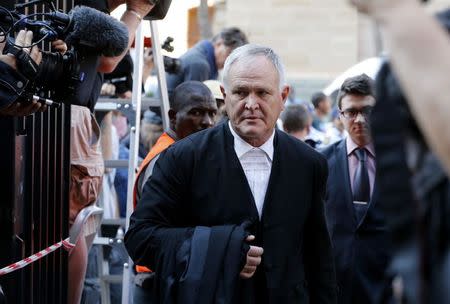 Barry Roux, lawyer for South African Olympic and Paralympic sprinter Oscar Pistorius, arrives at the North Gauteng High Court in Pretoria September 12, 2014. REUTERS/Mike Hutchings