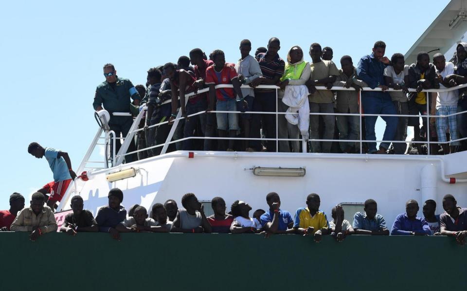 Migrants wait to disembark from the Spanish ship 'Rio Segura' in the harbour of Salerno, Italy, Thursday, June 29, 2017 - Credit: AP