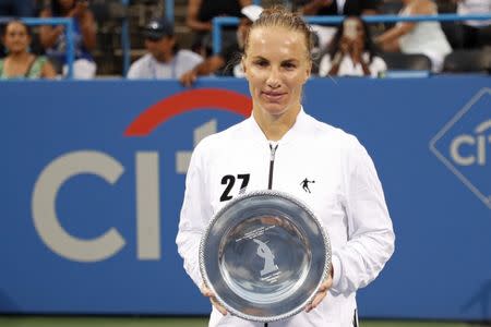 Aug 5, 2018; Washington, DC, USA; Svetlana Kuznetsova of Russia holds the Donald Dell Trophy after her match against Donna Vekic of Croatia (not pictured) in the women's singles final in the Citi Open at Rock Creek Park Tennis Center. Kuznetsova won 4-6, 7-6(7), 6-2. Mandatory Credit: Geoff Burke-USA TODAY Sports