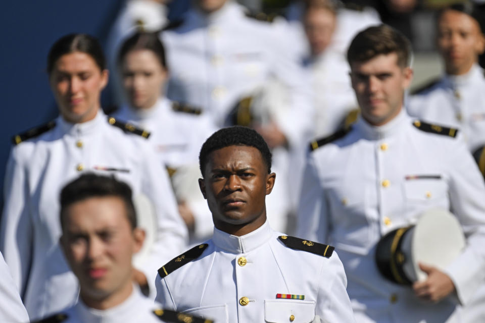 Members of the class of 2023 enter Navy-Marine Corps Memorial Stadium before the U.S. Naval Academy's graduation and commissioning ceremony at the Navy-Marine Corps Memorial Stadium on Friday, May 26, 2023 in Annapolis, Md. (Jerry Jackson /The Baltimore Sun via AP)