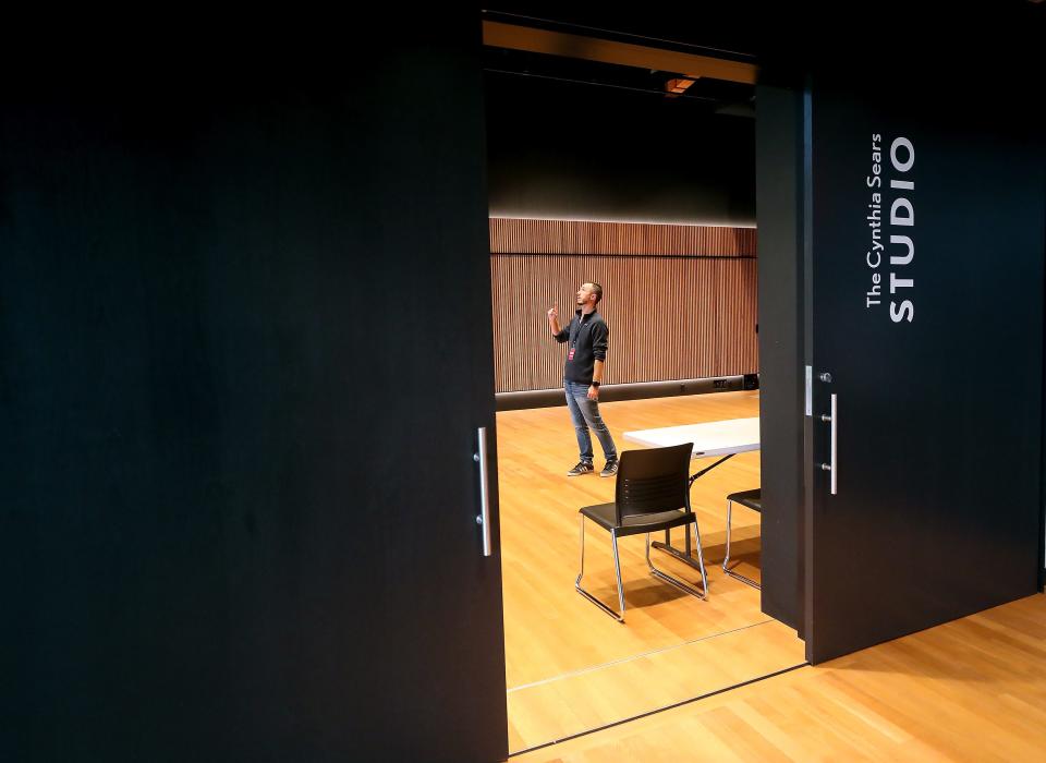 Matt Longmire, communication and development coordinator for Bainbridge Performing Arts, is framed in the doorway of the Cynthia Sears Studio while giving a tour of the new space on Tuesday, Sept. 26, 2023.