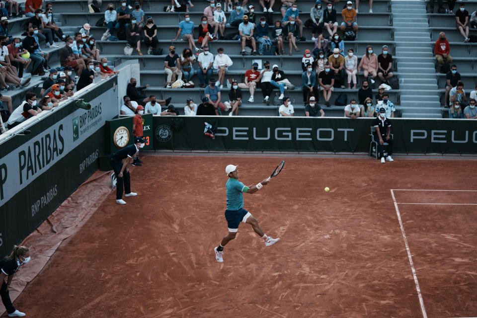 Japan's Kei Nishikori returns the ball to Italy's Alessandro Giannessi during their first round match of the French Open tennis tournament at the Roland Garros stadium Sunday, May 30, 2021 in Paris. (AP Photo/Thibault Camus)