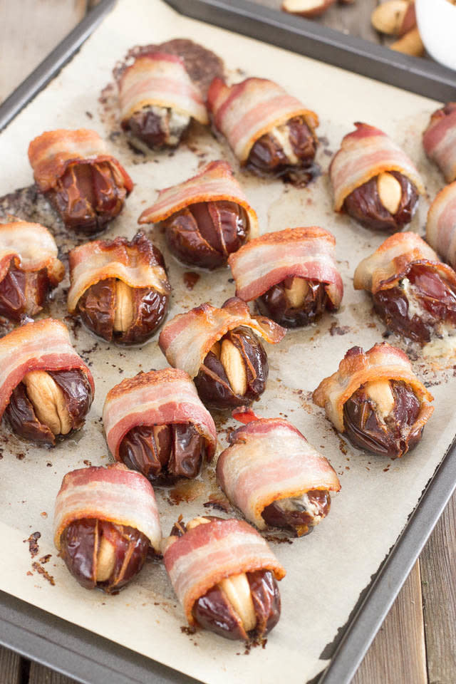 <strong>Get the <a href="http://thehealthyfoodie.com/bacon-wrapped-stuffed-dates/" target="_blank">Bacon-Wrapped Stuffed Dates recipe</a> from The Healthy Foodie</strong>
