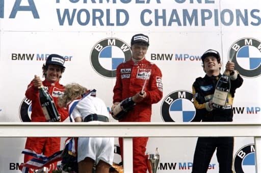 World champion Niki Lauda (C) celebrated his victory in the Dutch Grand Prix in Zandvoort in 1985 with McLaren teammate Alain Prost (L), second, and Ayrton Senna, third