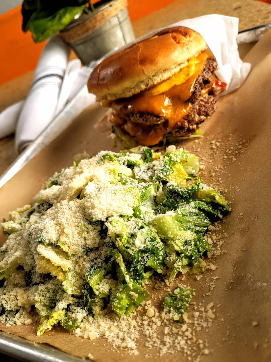 A Brisket Cheeseburger pairs nicely with the restaurant’s parmesan-topped Garlicky Romaine Salad.