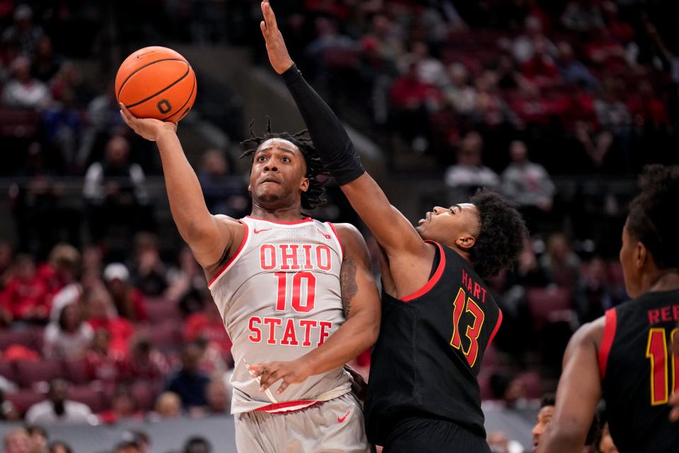 Mar 1, 2023; Columbus, Ohio, United States;  Ohio State Buckeyes forward Brice Sensabaugh (10) makes a shot while defended by Maryland Terrapins guard Hakim Hart (13) during the second half of the NCAA Division I basketball game between the Ohio State Buckeyes and the Maryland Terrapins at Value City Arena on Wednesday night. Mandatory Credit: Joseph Scheller-The Columbus Dispatch