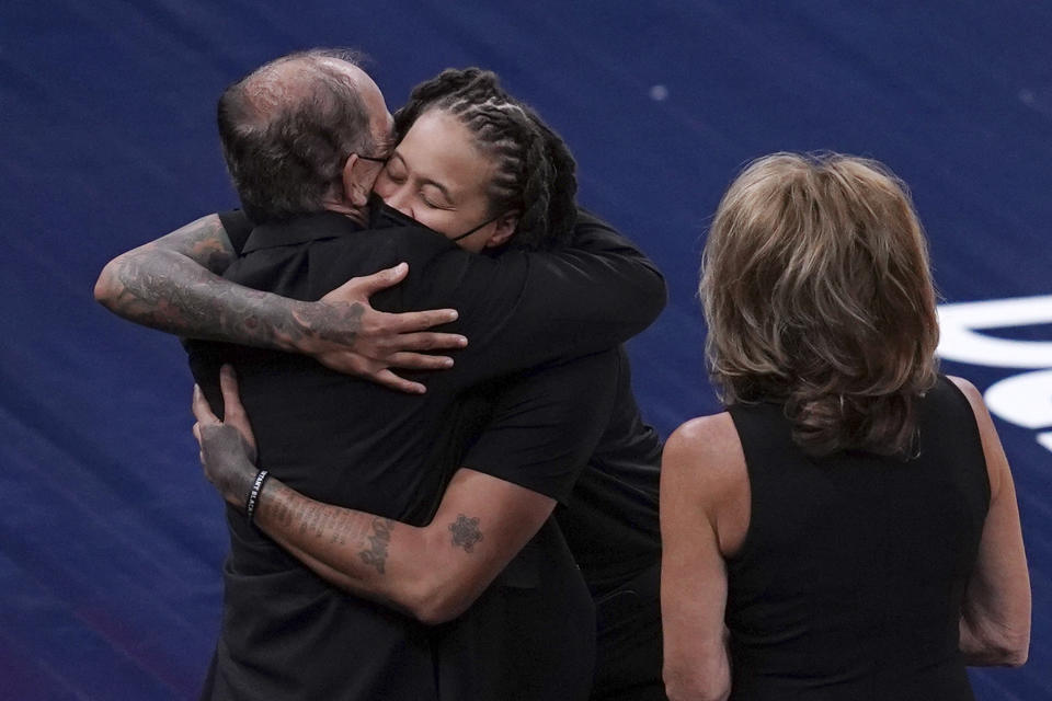 Los Angeles Sparks assistant coach and former Minnesota Lynx star Seimone Augustus, second from left, greets Lynx owners Glen and Becky Taylor before a WNBA basketball game Saturday, June 12, 2021, in Minneapolis. (Anthony Souffle/Star Tribune via AP)