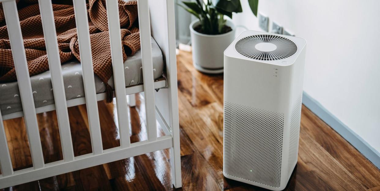 air purifier in the nursery for fresh air cleaning and removing dust and bacteria healthier life and living concept