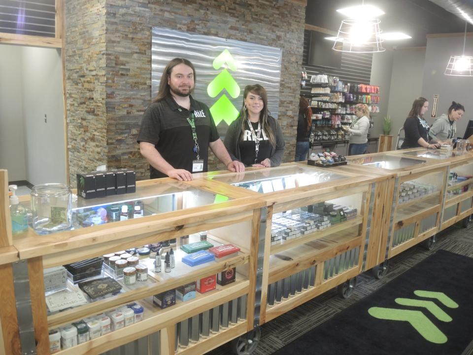 Erik Varga and Michelle Willes inside the Green Arrow marijuana outlet on Main Street in Gaylord. The store is the third retail dispensary to open in the city since the council approved an ordinance legalizing the recreational use of the drug in 2021.