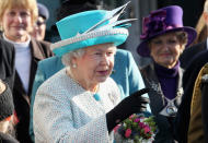 KING'S LYNN, ENGLAND - FEBRUARY 06: Queen Elizabeth II points during a visit to Dersingham School on February 6, 2012 in King's Lynn, England. The Queen made the visit to the school as she celebrates Accession Day and 60 years on the throne. (Photo by Chris Jackson/Getty Images)