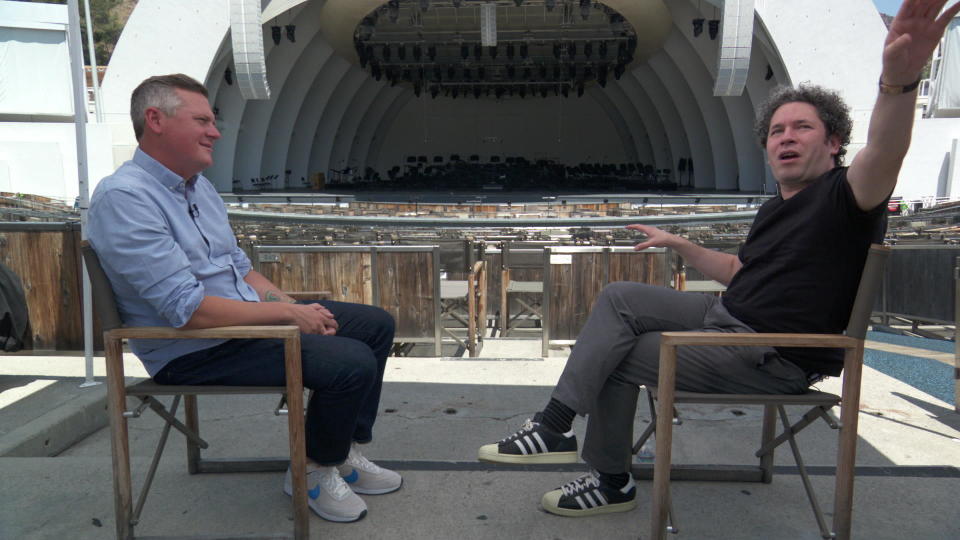 Correspondent Luke Burbank with Gustavo Dudamel, music and artistic director of the Los Angeles Philharmonic, at the Hollywood Bowl.  / Credit: CBS News