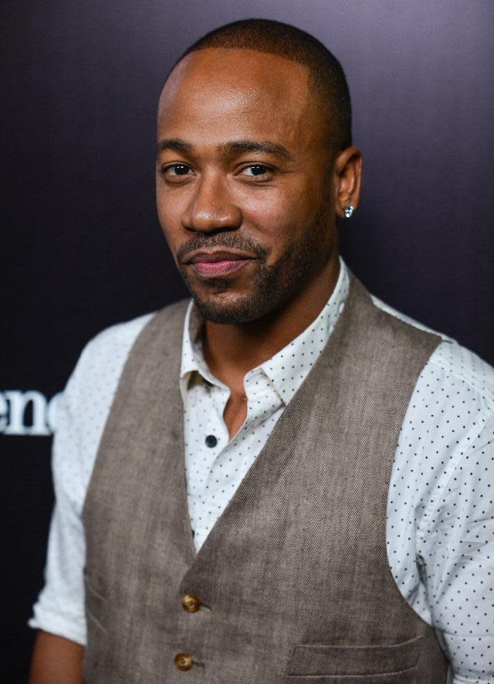 FILE - This Nov. 7, 2013 file photo shows Columbus Short at the Ermenegildo Zegna Boutique opening in Beverly Hills, Calif. Short won't be returning to "Scandal" following his legal troubles. The 31-year-old actor says in a statement on Friday, April 25, 2014, he's exiting the ABC political thriller after three seasons. (Photo by Richard Shotwell/Invision/AP, File)