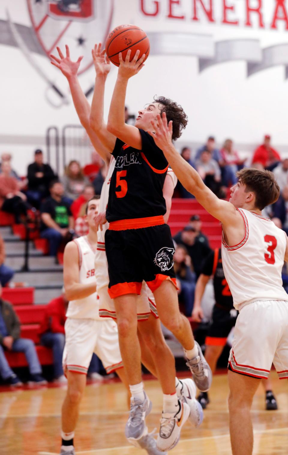 Isaiah Stephens goes up for a shot in the lane against Sheridan on Tuesday night. Stephens had a game-high 24 points as the Panthers improved to 3-1 with a 57-34 win.