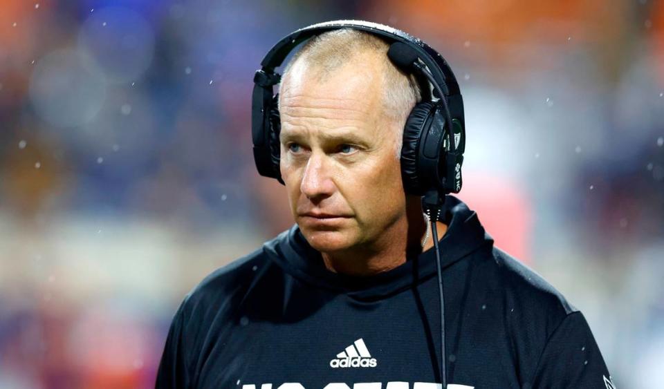 N.C. State head coach Dave Doeren walks on the field during a timeout in the second half of N.C. State’s 24-21 victory over Virginia at Scott Stadium in Charlottesville, Va., Friday, Sept. 22, 2023.