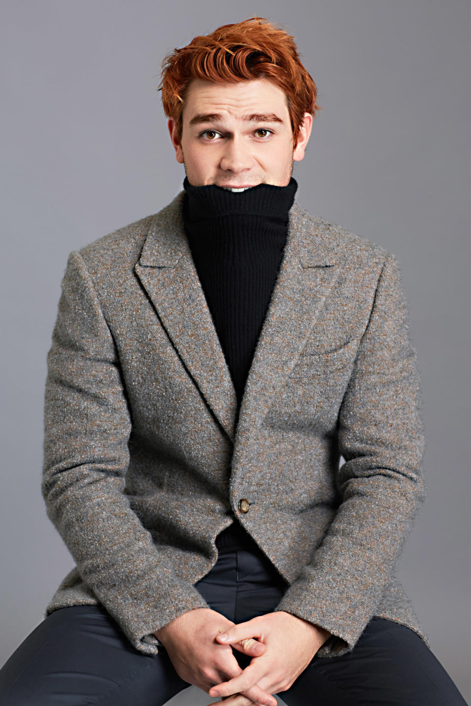 <p>Suit jacket by Ermenegildo Zegna Couture, turtleneck sweater by Theory, trousers by Tommy Hilfiger.</p>