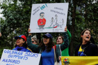 Protesters demonstrate outside of Goldman Sachs headquarters after the company purchased Venezuelan bonds in New York, U.S., May 30, 2017. REUTERS/Lucas Jackson