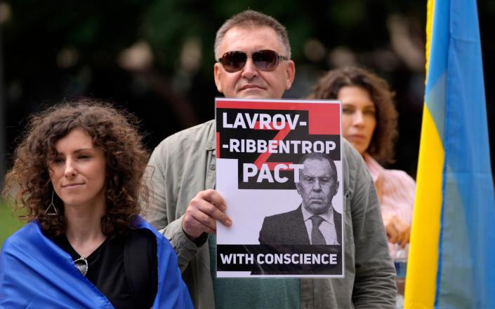 People attend a protest against Russian Foreign Minister Sergey Lavrov's visit to Belgrade&nbsp; - Darko Vojinovic/AP