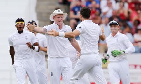 Cricket - West Indies v England - Second Test - National Cricket Ground, Grenada - 21/4/15 England's James Anderson celebrates the wicket of West Indies' Kraigg Brathwaite with Ben Stokes Action Images via Reuters / Jason O'Brien