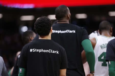 Mar 25, 2018; Sacramento, CA, USA; Members of the Boston Celtics stand on the court during a timeout against the Sacramento Kings in the third quarter at Golden 1 Center. Players from both teams wore t-shirts on the bench in honor of Stephon Clark, a Sacramento native who was recently shot and killed by Sacramento police. Cary Edmondson-USA TODAY Sports