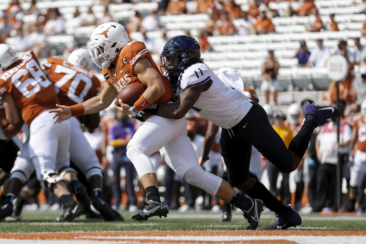 Khari Coleman #11 of the TCU Horned Frogs tackles Sam Ehlinger #11 of the Texas Longhorns near the goal line on Oct. 3. (Tim Warner/Getty Images)