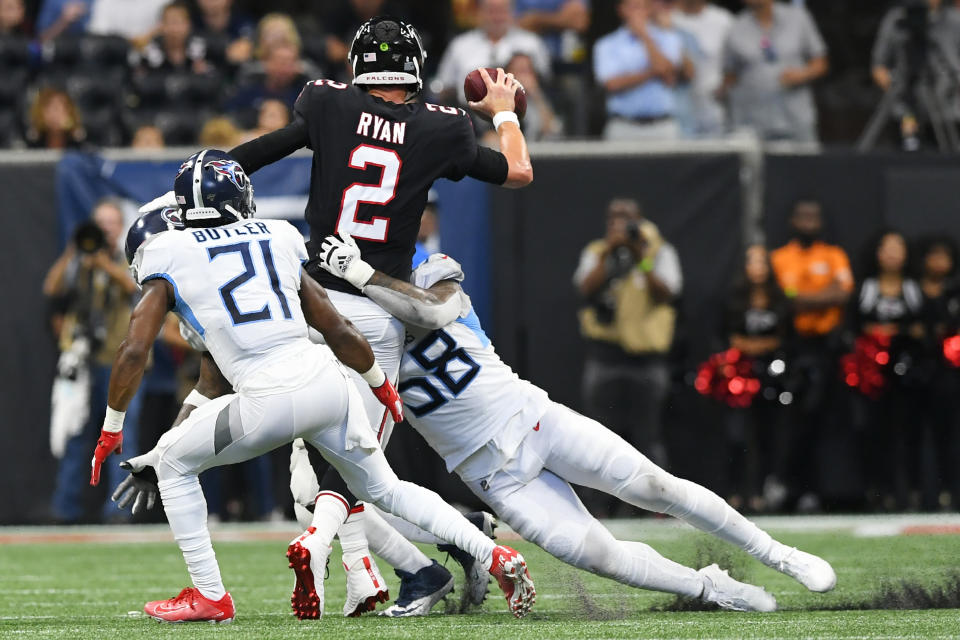 Tennessee Titans cornerback Malcolm Butler (21) and Tennessee Titans linebacker Harold Landry (58) sack Atlanta Falcons quarterback Matt Ryan (2) during the second half of an NFL football game, Sunday, Sept. 29, 2019, in Atlanta. (AP Photo/John Amis)