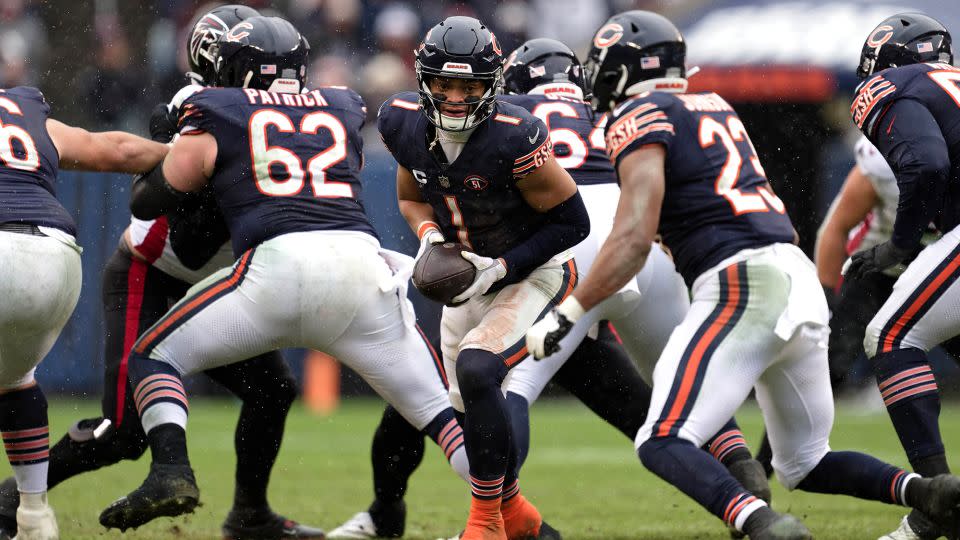 Fields hands off the ball during the Bears' game against the Atlanta Falcons. - Jamie Sabau/USA TODAY Sports/Reuters