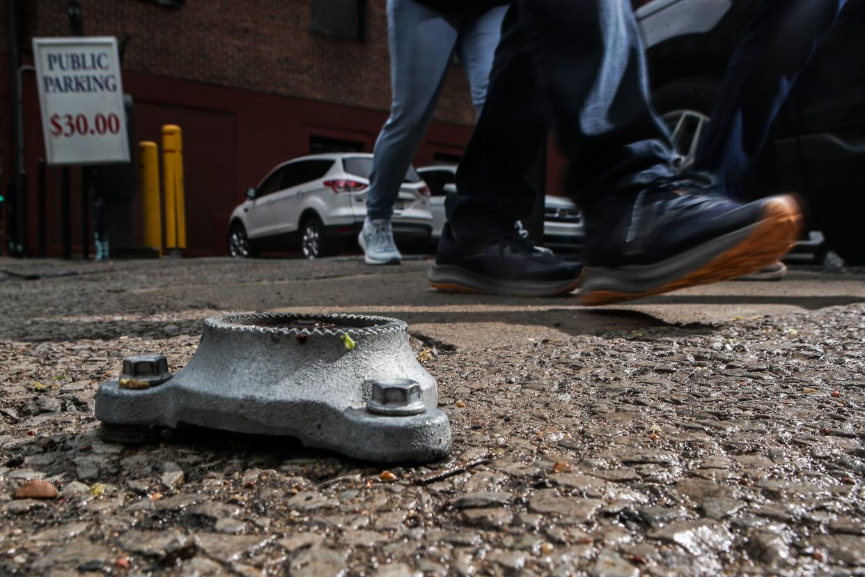 A metal bracket that's bolted into a public sidewalk on Third Street is known to be a tripping hazard for unwary pedestrians. John DeCamillis, an attorney downtown, has been asking the city of Louisville to fix the public sidewalks near his building on Third Street.