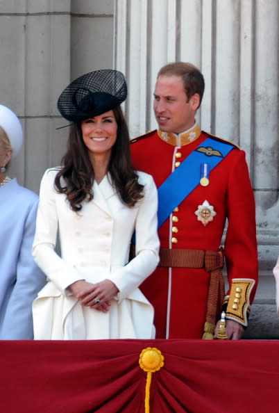 Kate Middleton perches in the balcony of Buckingham Palace with Prince William