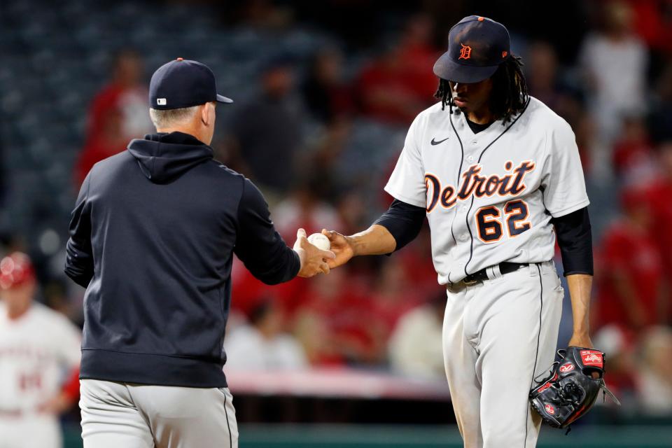 Detroit Tigers starting pitcher Jose Urena, right, gives the ball to manager A.J. Hinch after the Los Angeles Angels had scored five runs during the fifth inning of a baseball game in Anaheim, Calif., Friday, June 18, 2021.