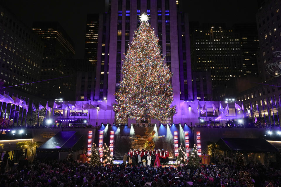 The Christmas tree at Rockefeller Center is lit in New York, Wednesday, Nov. 29, 2023. (AP Photo/Seth Wenig)
