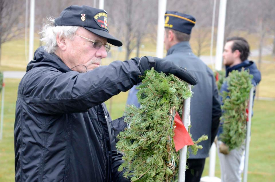 A veteran representing each branch of service and POW/MIA received a wreath to place on Saturday, Dec. 16, 2023 during the Wreaths Across America ceremony at Greenwood Cemetery in Petoskey.