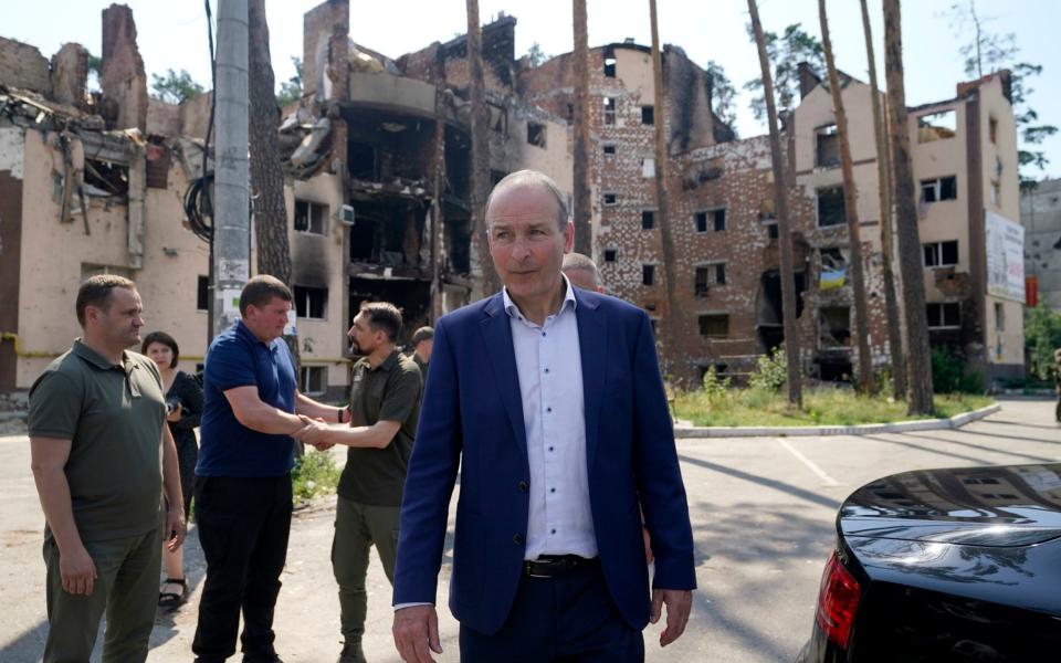 The Irish leader with local officials viewing the damage to buildings in the city of Irpin, Ukraine, on July 6, 2022 - Niall Carson/ PA