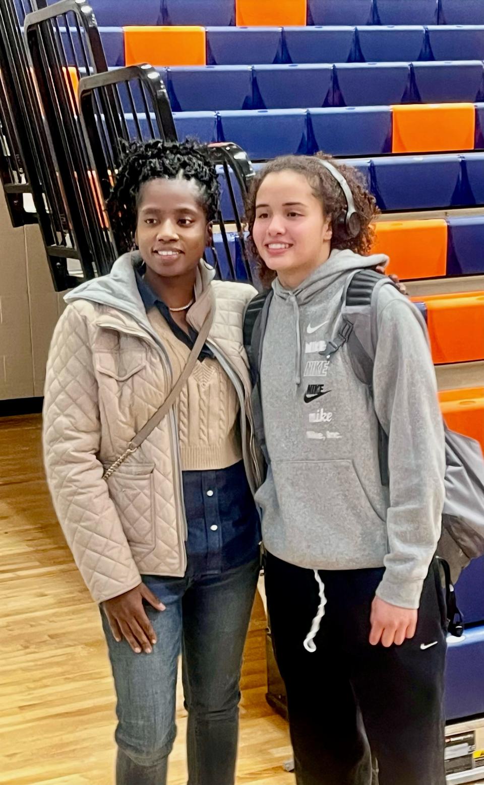 Former Ellet star Markita Griffin-Roberts, left, and junior guard Caitlyn Holmes pose for a photograph after Holmes broke Griffin-Roberts' Ellet girls basketball scoring record on Thursday night during a win over Avon in a Division I sectional final.