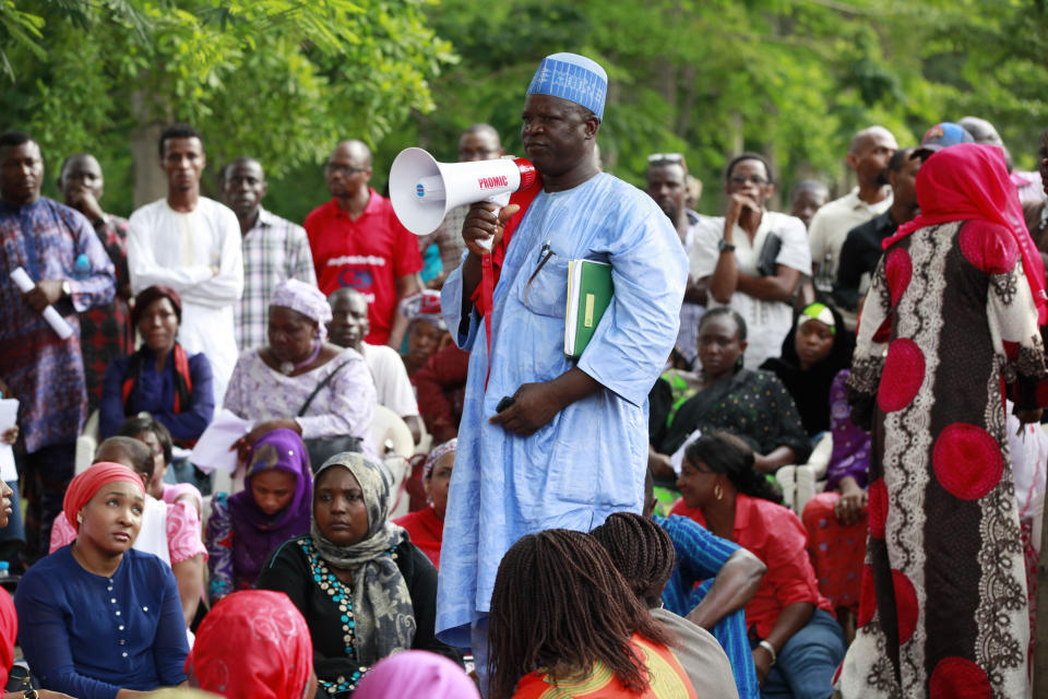 Hosea Abana, centre, the chairman of the Chibok community in Abuja, pauses, during a rally calling on the Government to rescue the school girls kidnapped from the Chibok Government secondary school, in Abuja, Nigeria, Saturday May 10, 2014. The president of Nigeria for weeks refused international help to search for more than 300 girls abducted from a school by Islamic extremists, one in a series of missteps that have led to growing international outrage against the government. The waiting has left parents in agony, especially since they fear some of their daughters have been forced into marriage with their abductors for a nominal bride price of $12. Boko Haram leader Abubakar Shekau called the girls slaves in a video this week and vowed to sell them. "For a good 11 days, our daughters were sitting in one place," said Enoch Mark, the anguished father of two girls abducted from the Chibok Government Girls Secondary School. "They camped them near Chibok, not more than 30 kilometers, and no help in hand. For a good 11 days." (AP Photo/Sunday Alamba)