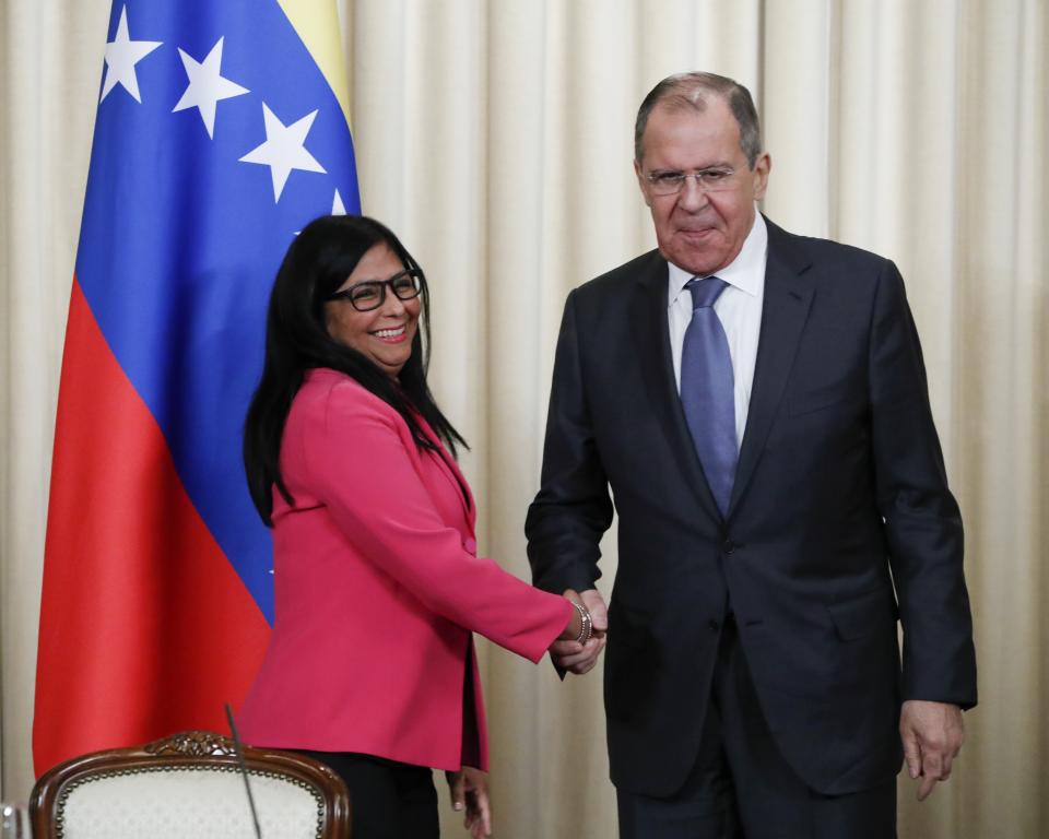 Russian Foreign Minister Sergey Lavrov, right, and Venezuela's Vice President Delcy Rodriguez shake hands after a joint news conference following their talks in Moscow, Russia, Friday, March 1, 2019. Venezuela’s vice president is visiting Russia, voicing hope for stronger ties with Moscow amid the U.S. pressure. (AP Photo/Pavel Golovkin)