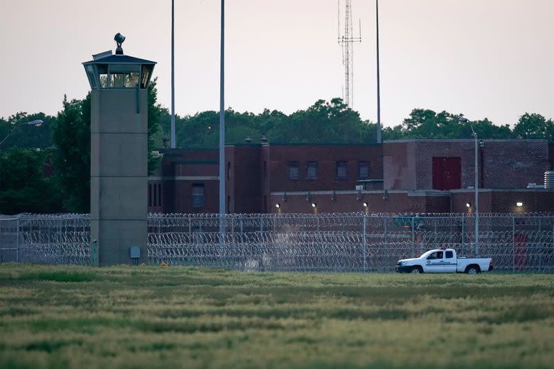 FILE PHOTO: A corrections vehicle patrols near the Federal Corrections Complex in Terre Haute