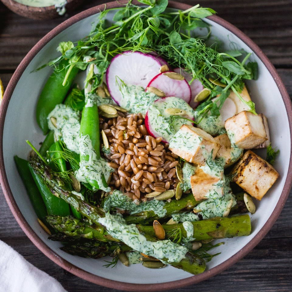 <p>This healthy grain bowl packs in the greens with peas, asparagus and a creamy yogurt dressing. Tofu adds protein while keeping it vegetarian, but you could also swap in cooked shrimp or chicken for a satisfying dinner or packable lunch ready in just 15 minutes.</p> <p> <a href="https://www.eatingwell.com/recipe/260739/green-goddess-buddha-bowl/" rel="nofollow noopener" target="_blank" data-ylk="slk:View Recipe;elm:context_link;itc:0;sec:content-canvas" class="link ">View Recipe</a></p>