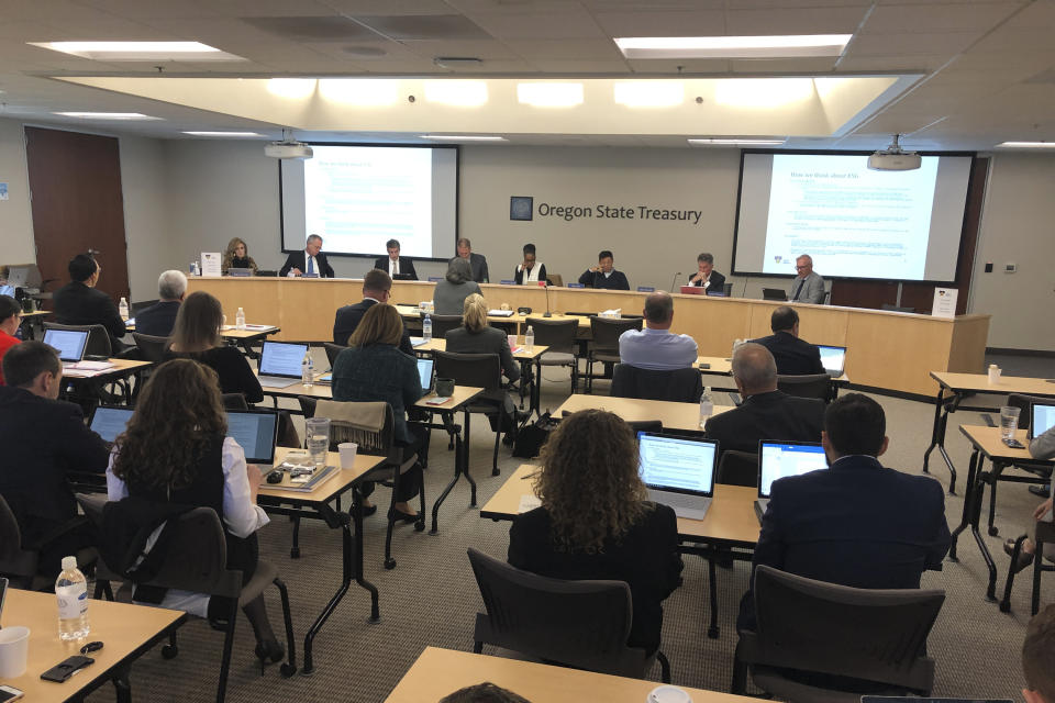 In this Oct. 30, 2019, photo, the Oregon Investment Council conducts its monthly meeting in Tigard, Ore. In 2017, the council decided unanimously to invest $233 million of the state workers' pension fund in Novalpina Capital, a private equity fund, which later bought into Israeli spyware company NSO Group. Major international human rights groups said NSO Group's Pegasus spyware has been used by repressive governments against human rights defenders, dissidents and journalists. (AP Photo/Andrew Selsky)