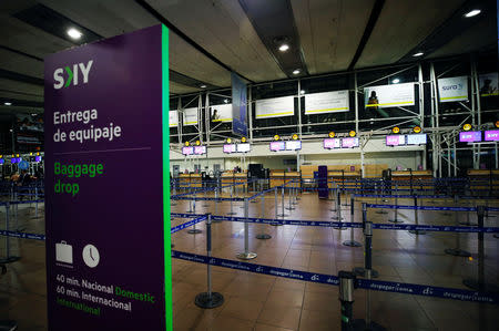 An empty check-in counters of Sky airlines is seen empty inside the departures area at international airport in Santiago, Chile August 16, 2018. REUTERS/Rodrigo Garrido