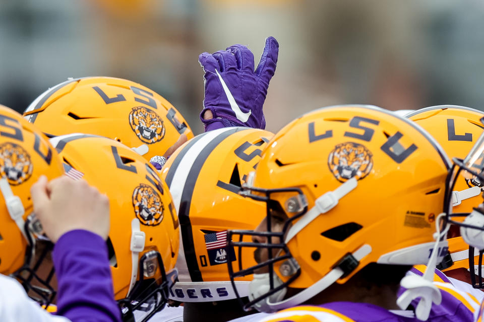 April 17, 2021; Baton Rouge, Louisiana; LSU Tigers huddle during warm ups before the annual Purple and White spring game at Tiger Stadium. Stephen Lew-USA TODAY Sports