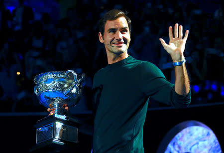 Tennis - Australian Open - Melbourne Park, Melbourne, Australia, January 11, 2018. Switzerland's Roger Federer holds the Men's singles trophy as he participates in the official draw ceremony ahead of the Australian Open tennis tournament. REUTERS/David Gray