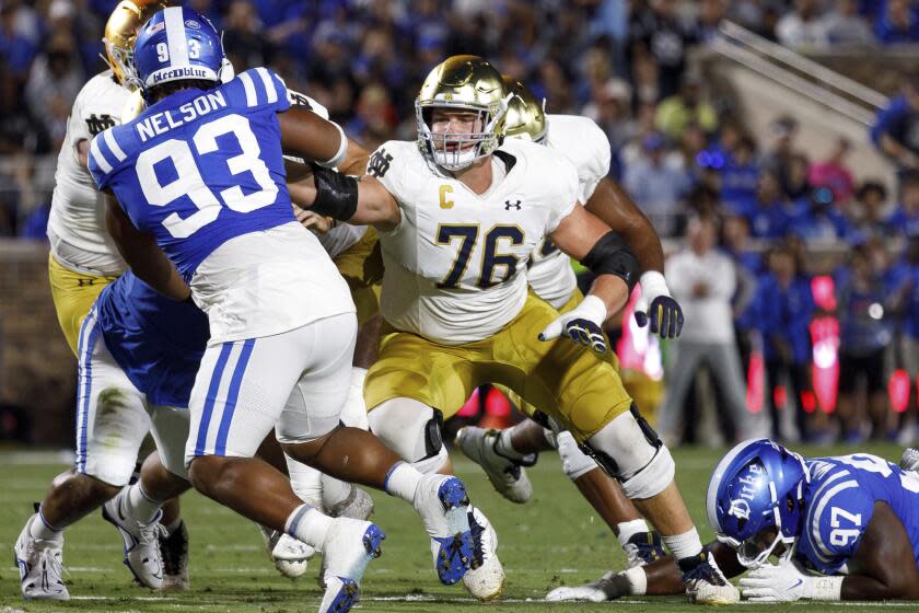 Notre Dame's Joe Alt (76) blocks during a game against Duke.  He will move to right tackle for the Chargers.