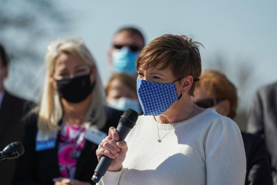 Michigan Department of Health and Human Services Director Elizabeth Hertel speaks during a press conference before the opening of a drive-thru vaccination clinic at the former Sears Auto Center site at the Lakeside Mall in Sterling Heights on Wednesday, March 31, 2021. 