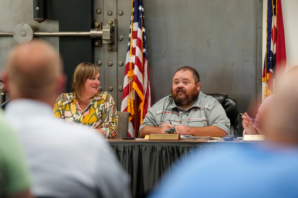 East Palestine Mayor Trent Conaway leads a city council meeting Monday, July 24, 2023, as the city continues to recover after a train derailment in February that caused dangerous chemicals that forced an evacuation of residents. At the time of the derailment, Conaway worked part-time as mayor while working full-time. He recently quit the full-time job to be more dedicated to the village of 4,700 residents.