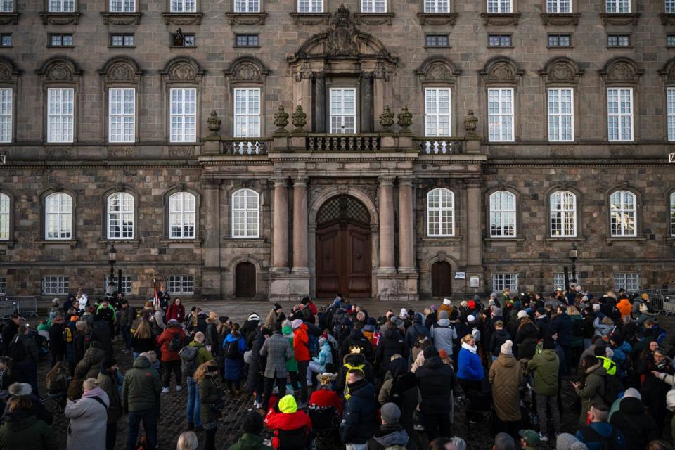 People gather in the early morning at Christiansborg Palace Square ahead of the proclamation of the abdication (AFP via Getty Images)