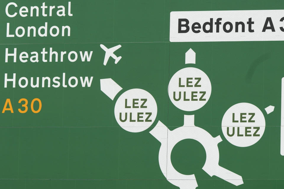 A road sign near a roundabout shows leaving roads into the Ultra Low Emission Zone (ULEZ) in London, Thursday, Aug. 24, 2023. London’s traffic cameras are under attack. Police say hundreds of license plate-reading cameras have been damaged, disconnected or stolen by opponents of an anti-pollution charge on older vehicles that comes into force across the metropolis on Tuesday. The vandalism is a sign of how high emotions are running over the Ultra Low Emission Zone. (AP Photo/Frank Augstein)